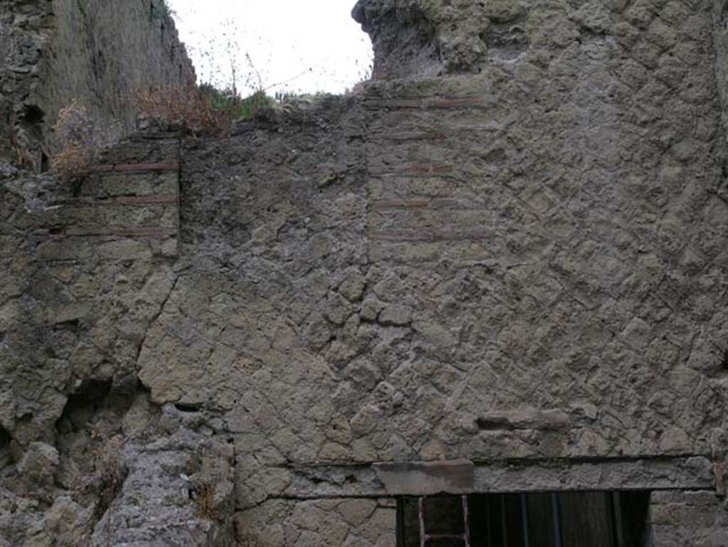 Ins Or II, 7, Herculaneum. June 2006.
Detail above doorway in west wall of a room, reached by Ins.Or.II.7, but which may be part of the rooms of the Palaestra at Ins.Or.II.4 (room C).
Photo courtesy of Nicolas Monteix.